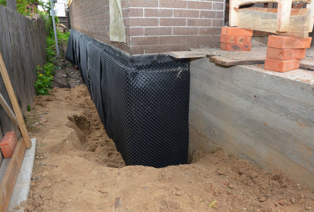 SJ Waterproofing Pros technician performing targeted Foundation Crack Repair assessment in Lakemore, OH